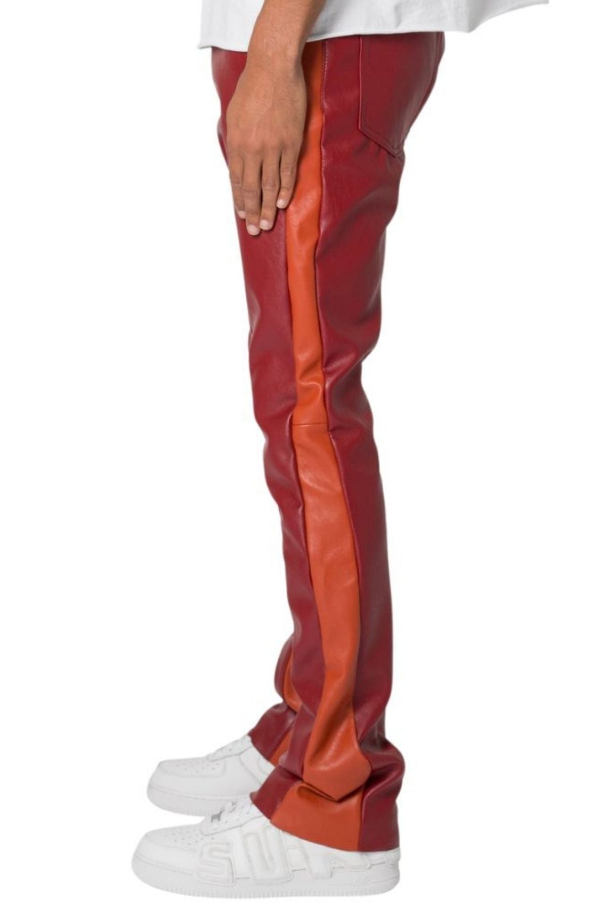 Red and orange striped pants with white sneakers on a white background