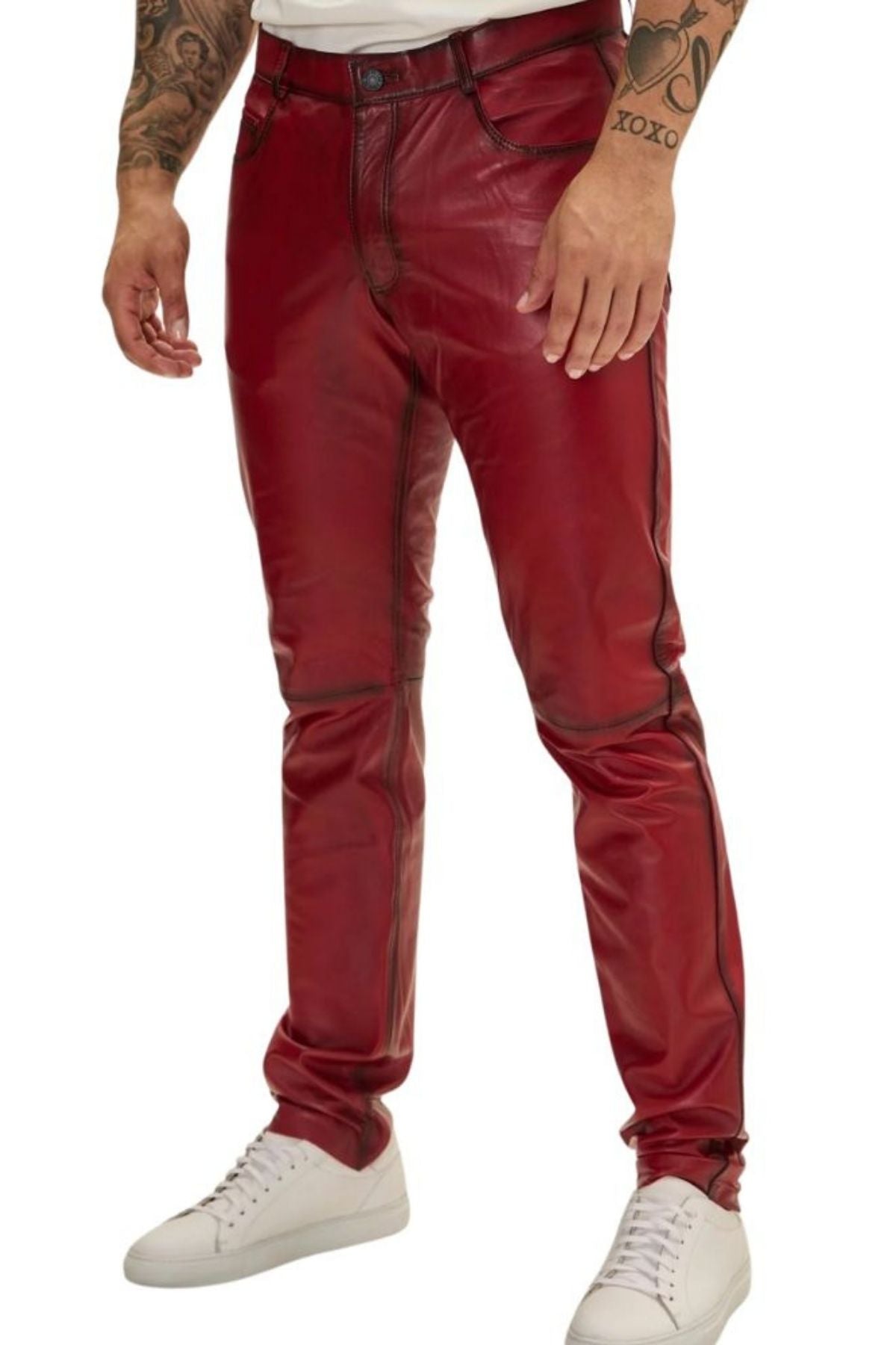 Red leather pants worn by a person on a white background