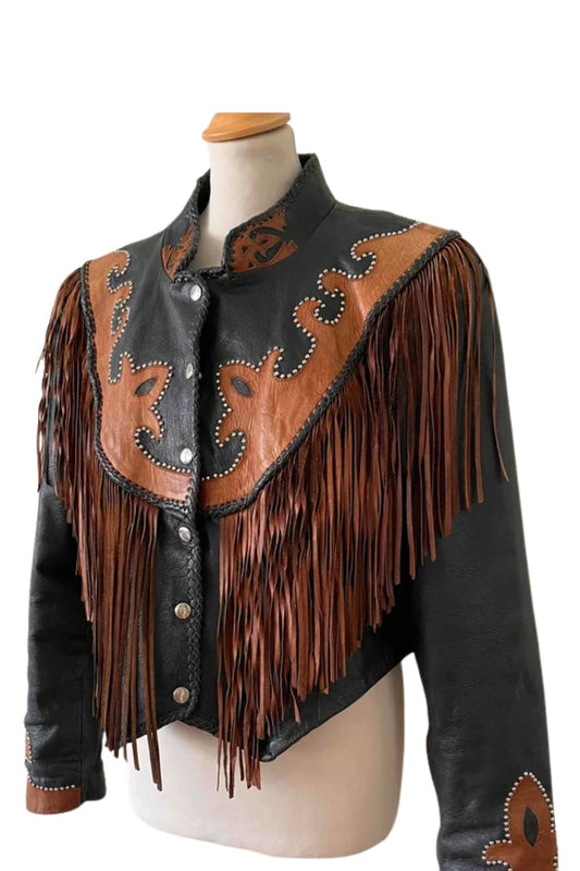 Black leather jacket with brown fringe and embroidery on a mannequin 
