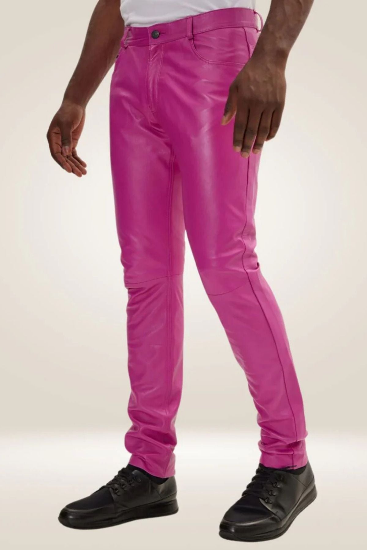 Person wearing bright pink pants on a white background