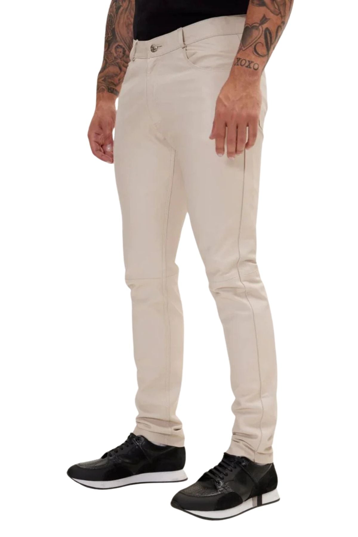 Beige jeans worn by a person on a white background