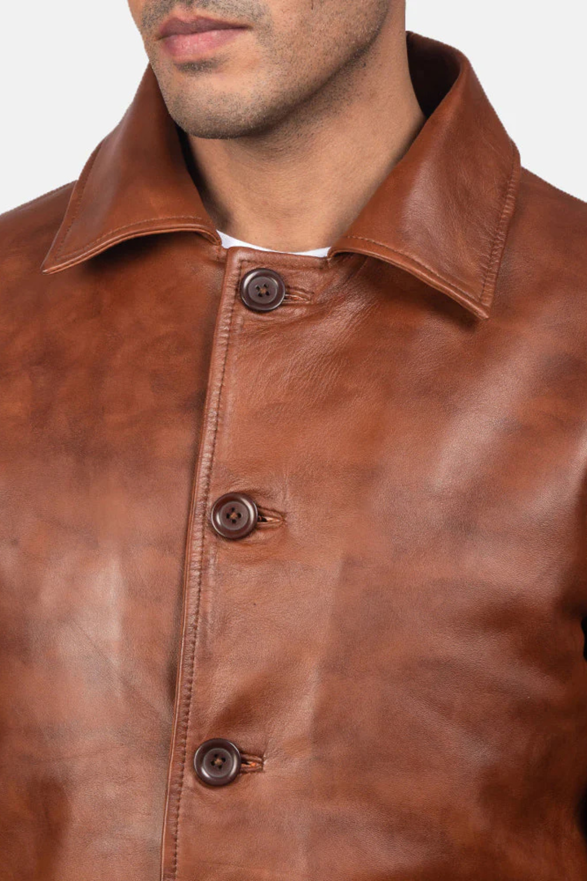 Close-up of a brown leather jacket with buttons 