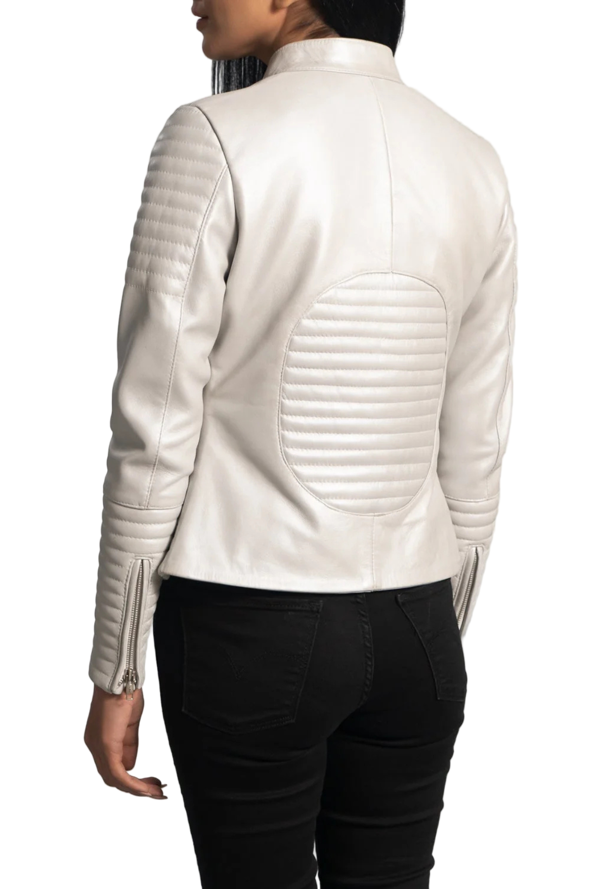 Person wearing a white leather jacket with black pants 