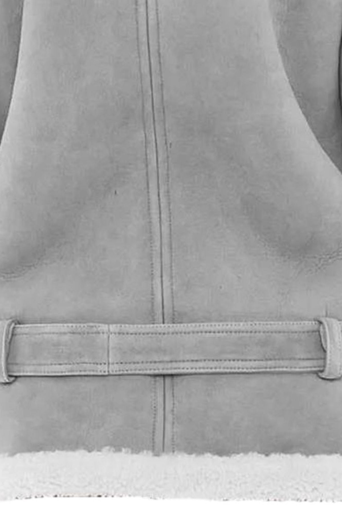 Close-up of a gray fleece vest with a zipper and snow visible at the bottom.