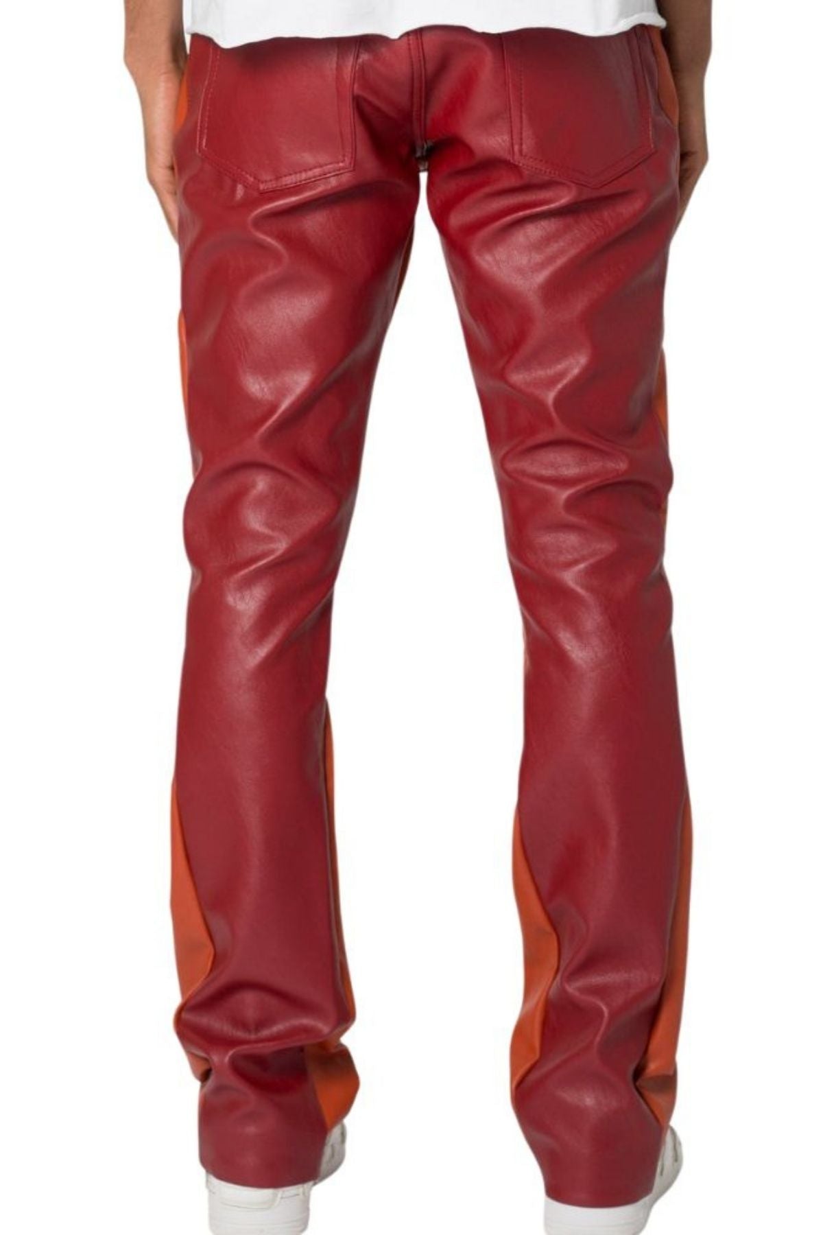 Red leather pants with orange accents worn by a person on a white background
