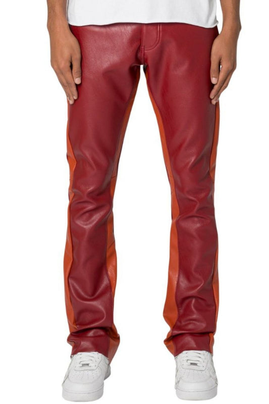 Red and orange leather pants worn by a person on a white background