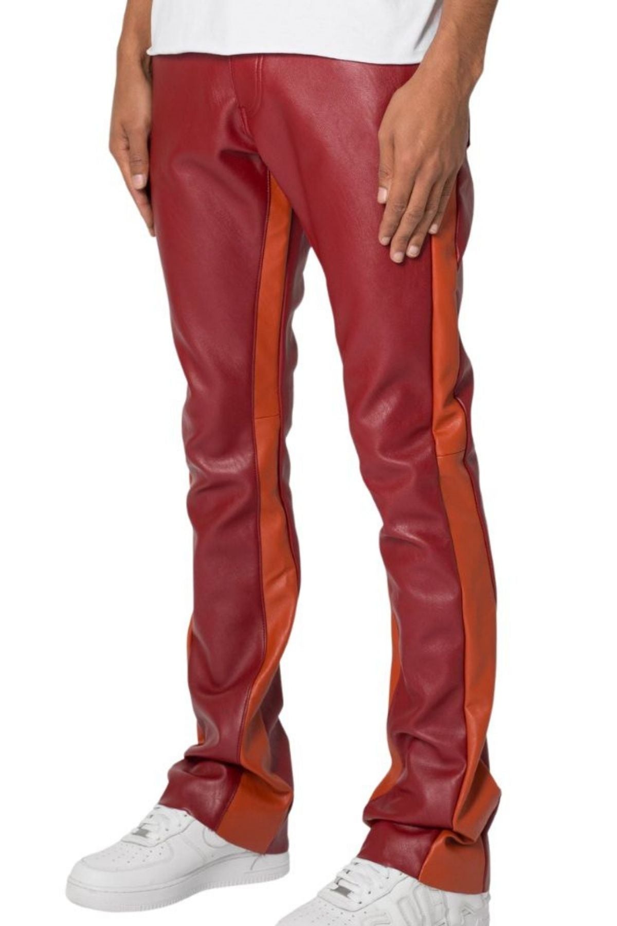 Red and orange leather pants worn by a person on a white background